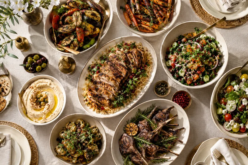 A balanced spread of mains and side dishes photographed from above