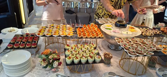 Assorted finger food and canapés arranged on tiered stands.