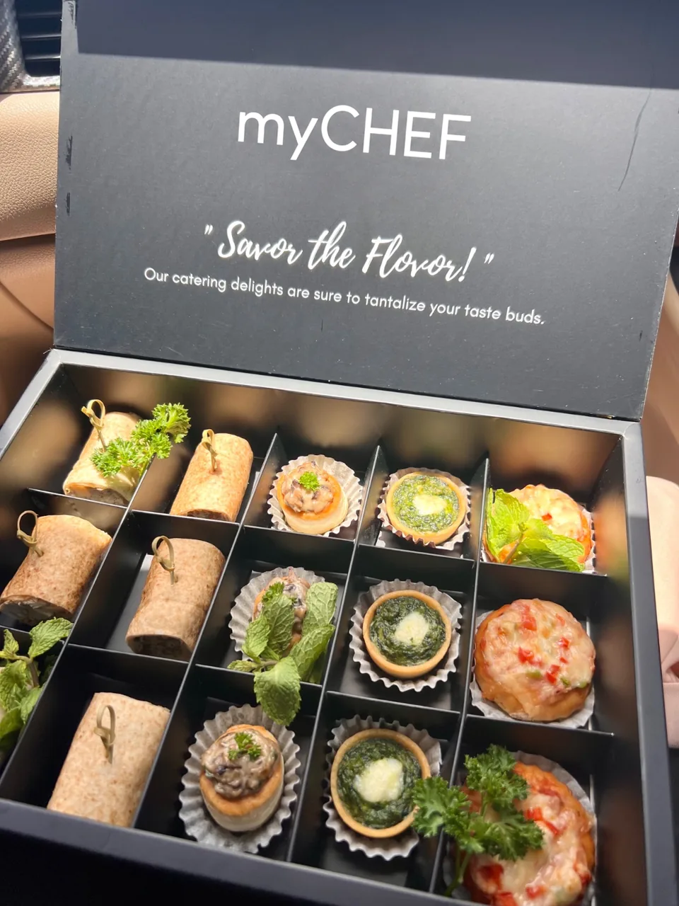 Boxed selection of individually presented savoury canapés.