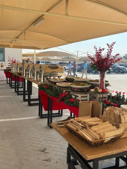 Long covered Christmas buffet ready for outdoor service.