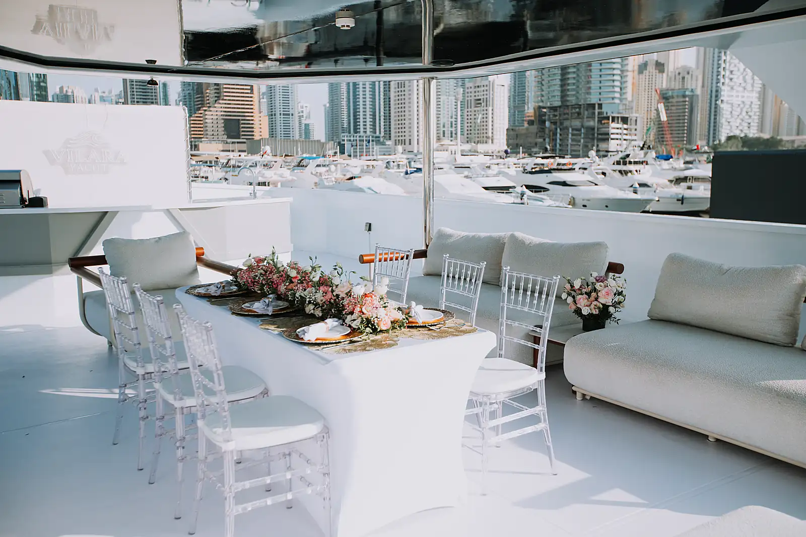 Seated table set on the upper deck of a chartered Dubai yacht, from a previous myCHEF catering day.