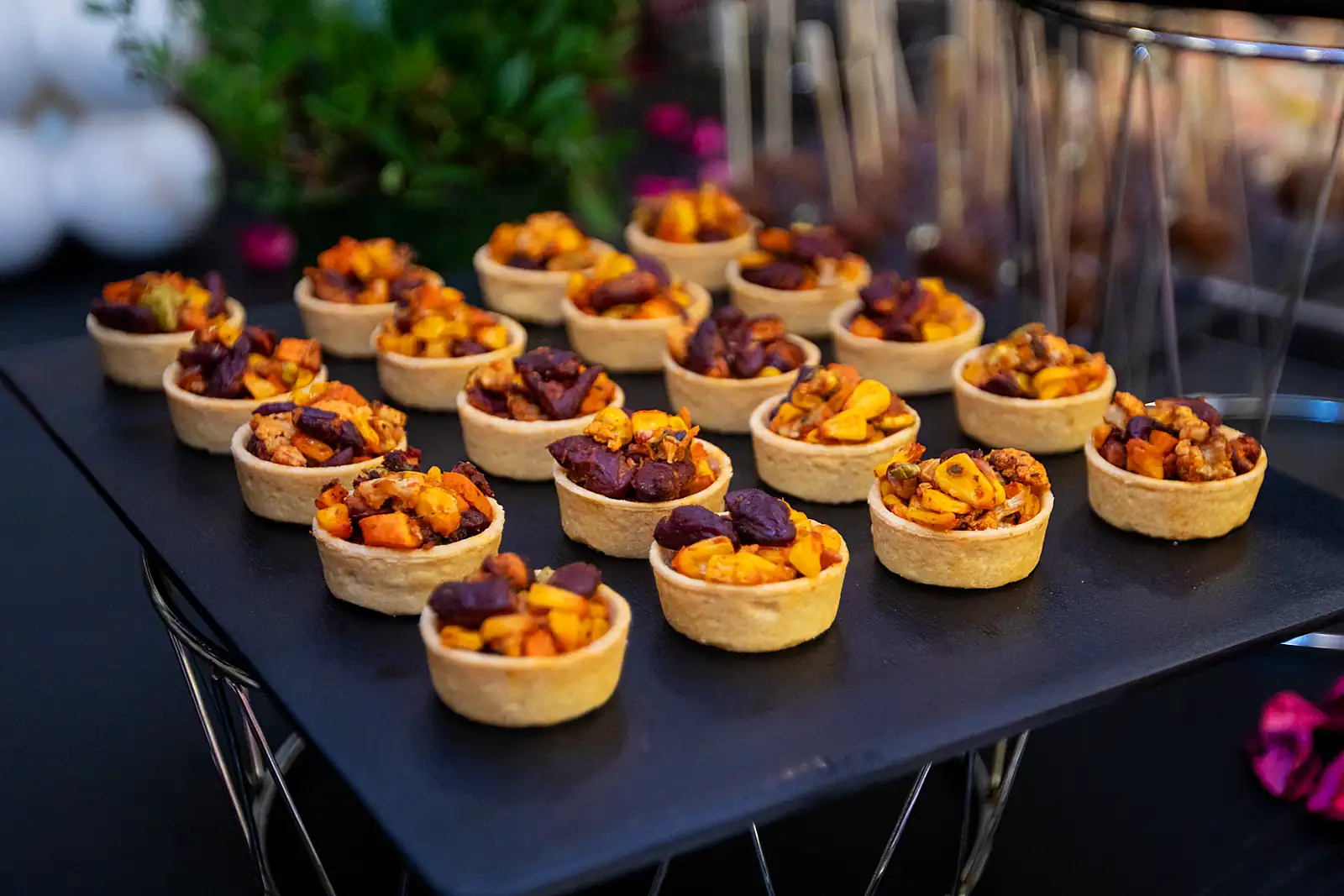 Nut tartlets set out on a slate for yacht dessert service, from a previous myCHEF catering day.