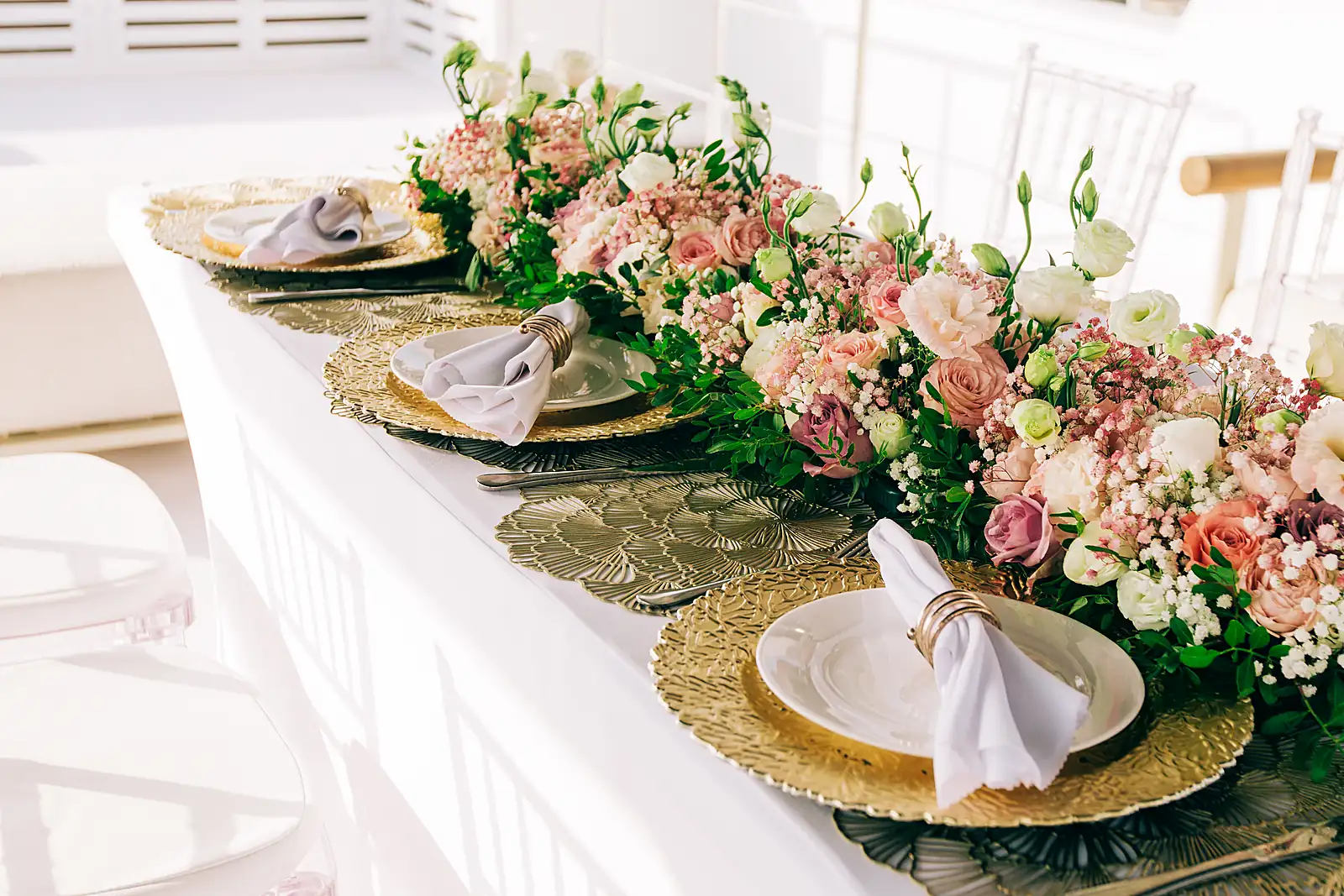 Tableware, chargers and napkins set on a yacht table, from a previous myCHEF catering day.