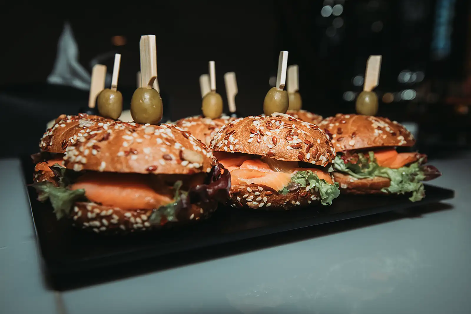 Smoked salmon sliders plated for yacht pass-around service, from a previous myCHEF catering day.
